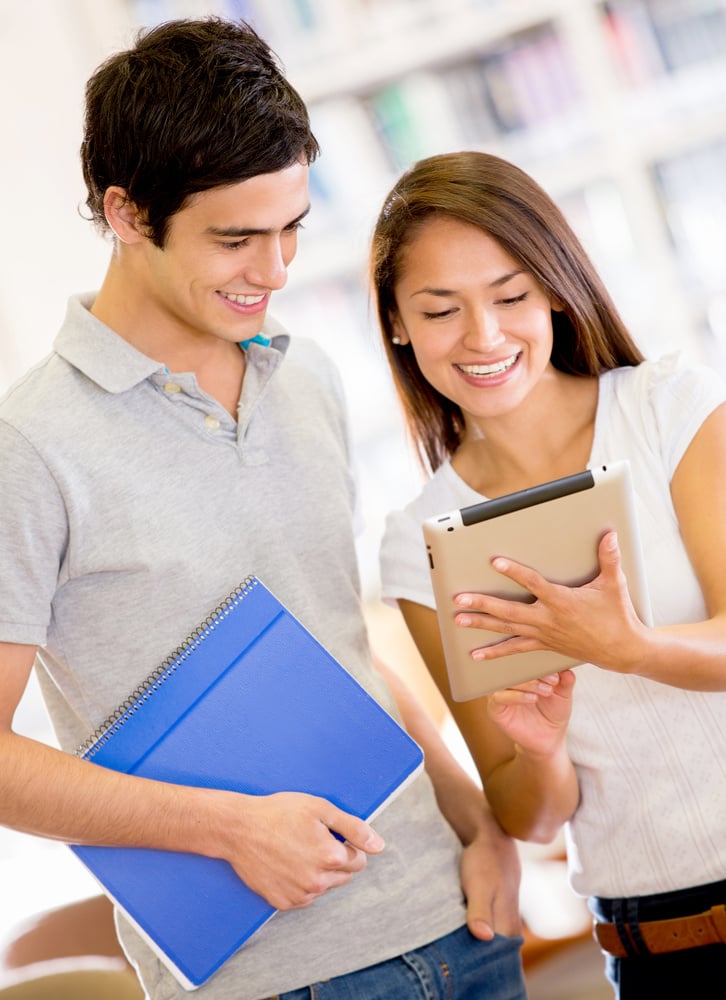 College students with a tablet computer using an app